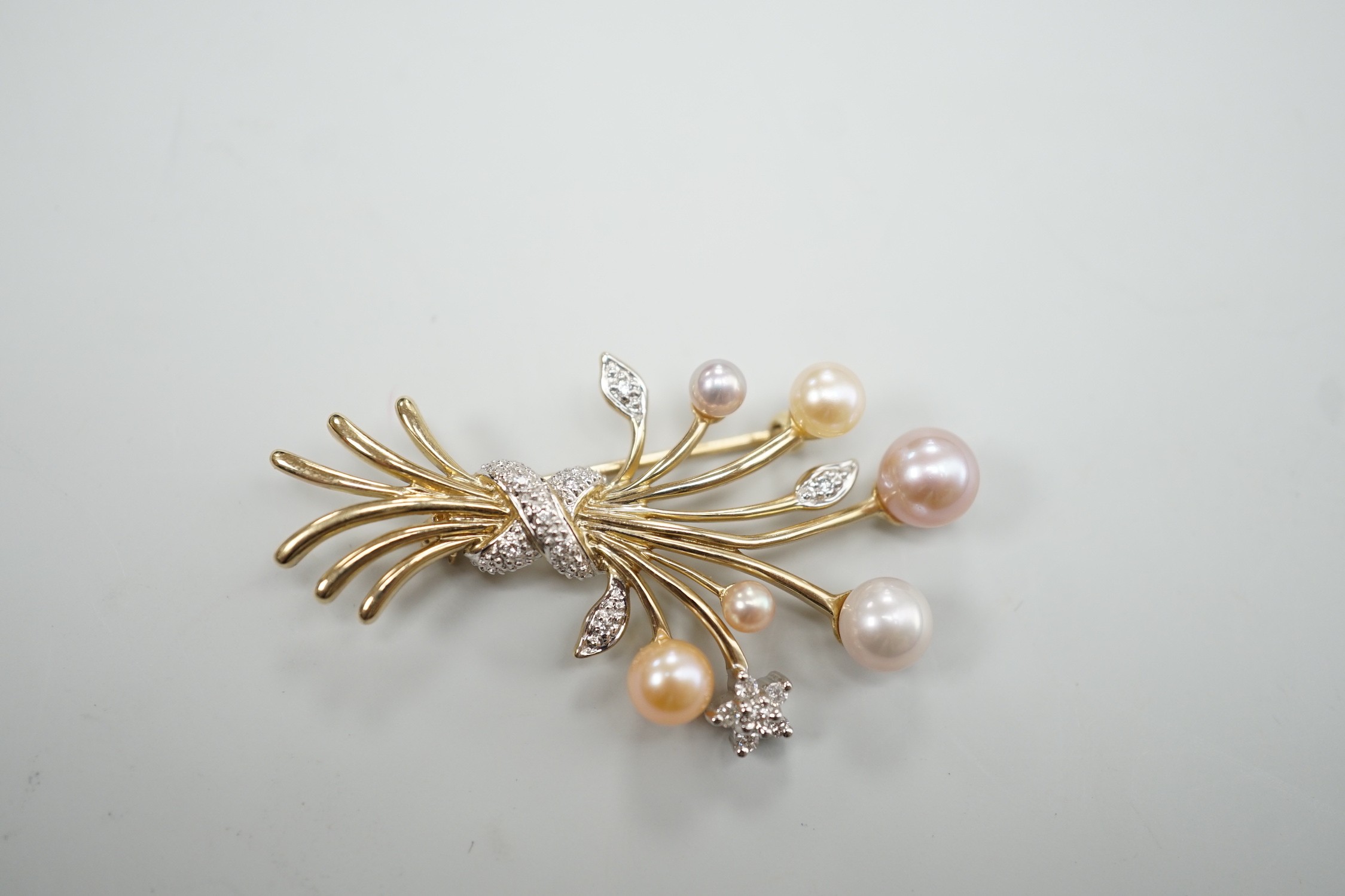 A modern 375 yellow metal, diamond chip and multi coloured graduated cultured pearl set spray brooch, 45mm
